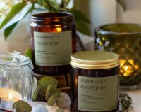 hand poured rosemary and eucalyptus candle made from natural wax in amber jar