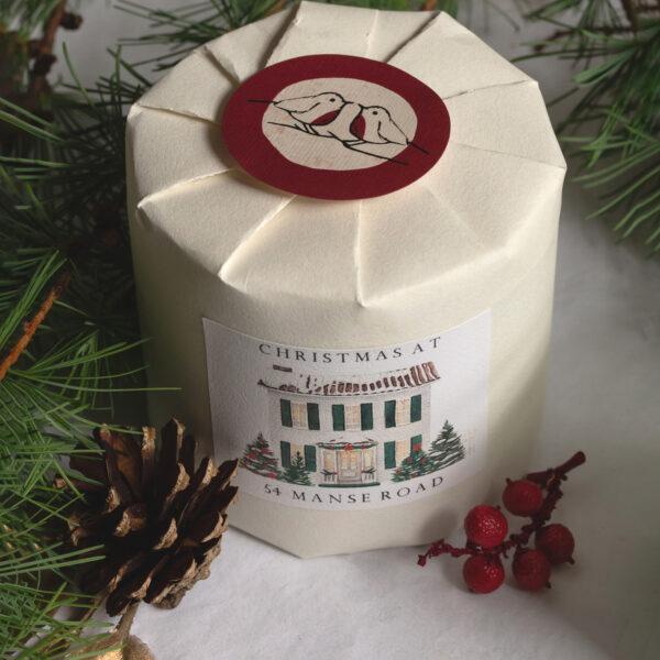 close up of scented personalised christmas natural wax candle