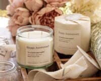 Personalised natural wax wedding anniversary candle in clear jar with gold lid. Handmade in Scotland
